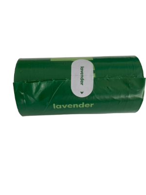 Green roll of lavender fragrance dog poop bags on a white background
